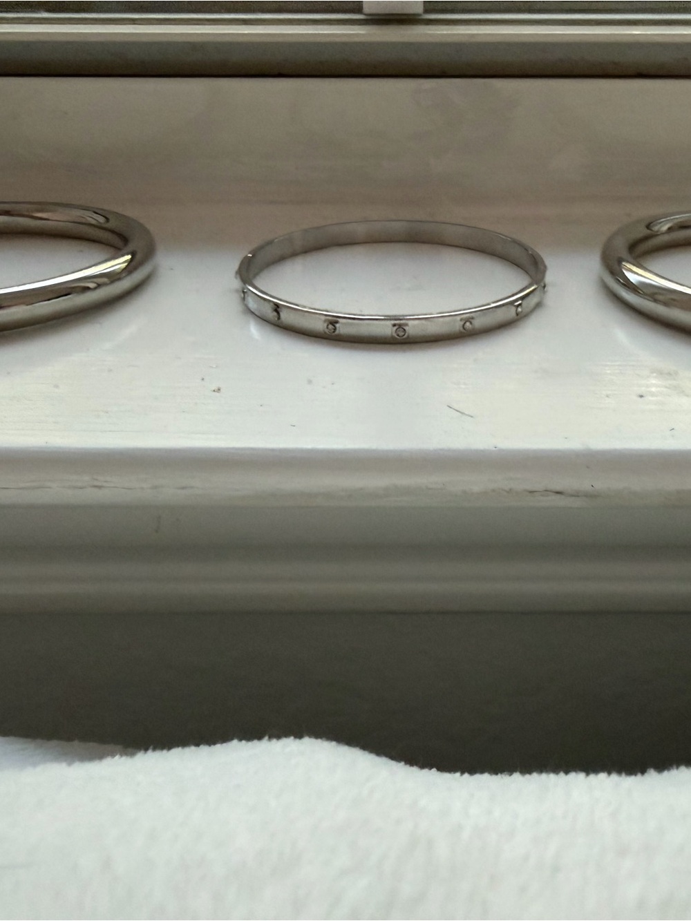 Polished Silver-Tone Hinged Bangle Bracelet with Stud Accents